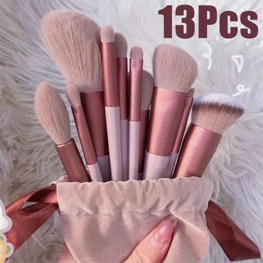 Set of 13 makeup brushes in a pink holder on a fluffy white background with '13Pcs' text.
