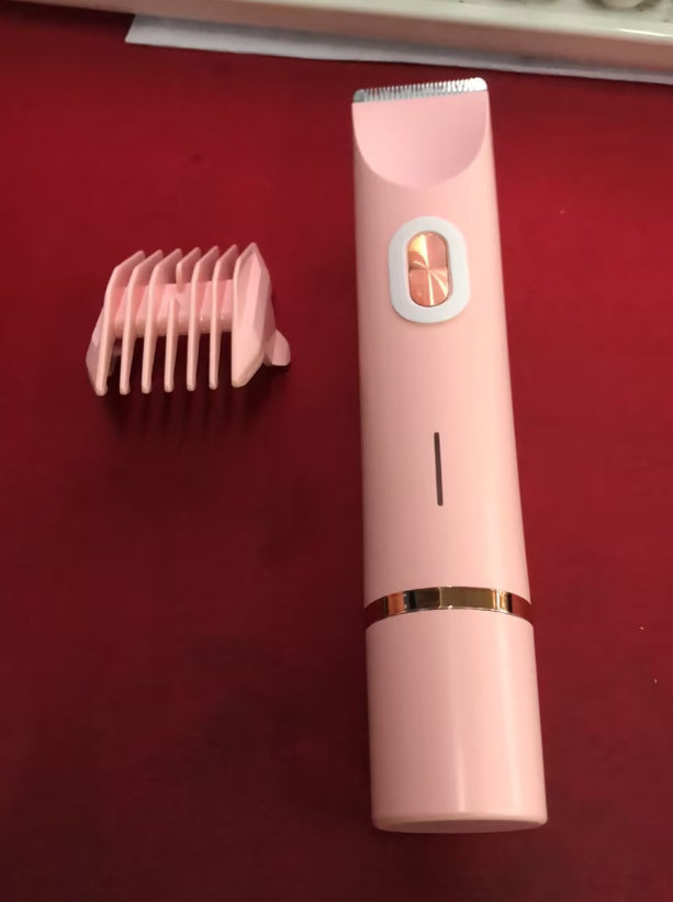 Pink electronic grooming tool with attachments on a red background