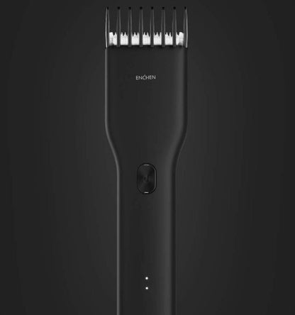 Black hair trimmer with visible brand logo on a dark background