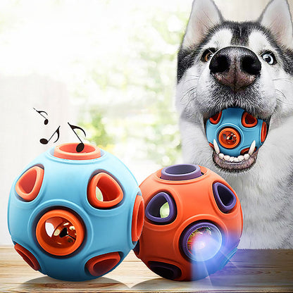 Two dog toys, one blue and one orange, with a dog holding the blue toy in its mouth.