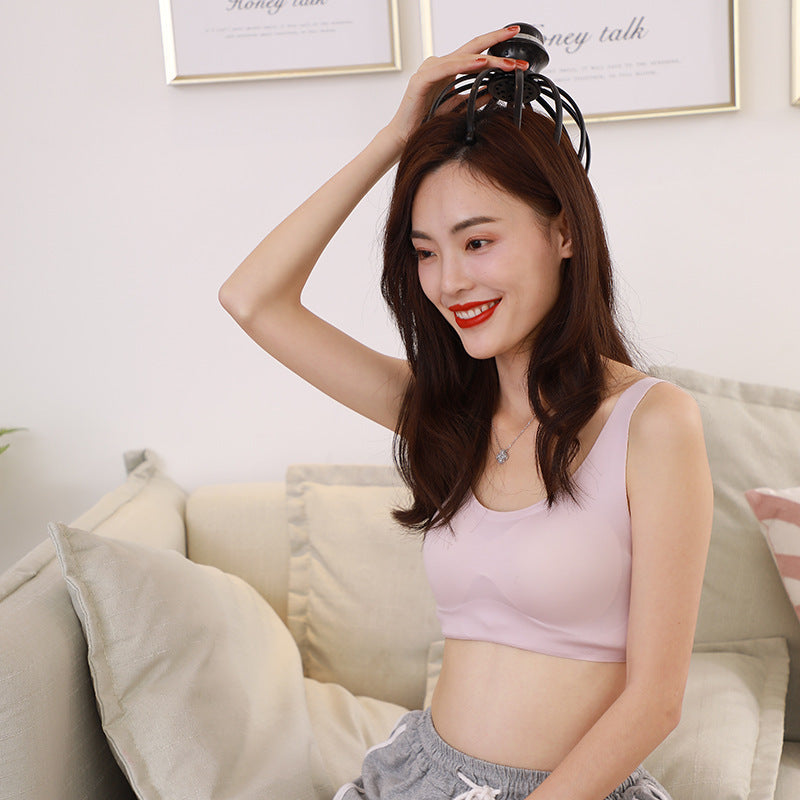 12-Claw Vibrating Scalp Massage Device - Woman using a hair dryer on her hair in a living room setting
