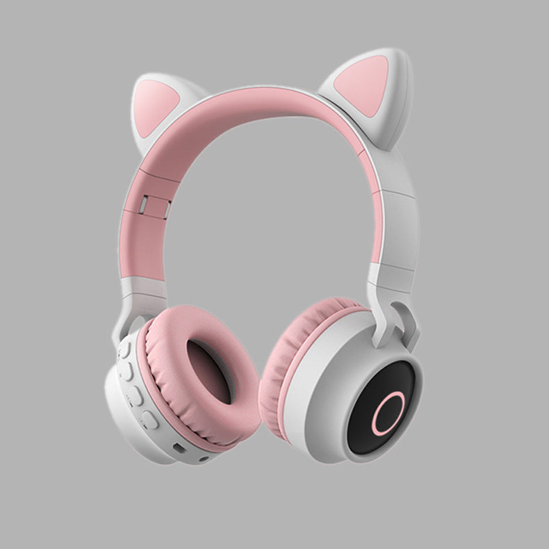 Bluetooth 5.0 Wireless Stereo Headphones - Pink and white headphones with cat ear design on a gray background