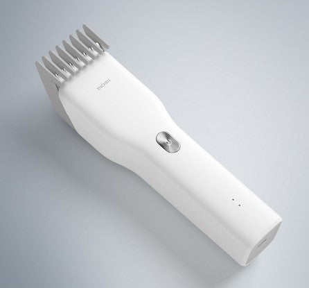 White hair clipper on a gray background