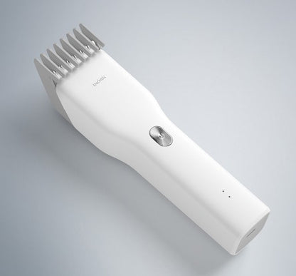 White hair clipper on a gray background