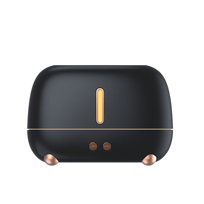 Black humidifier with gold accents on a white background