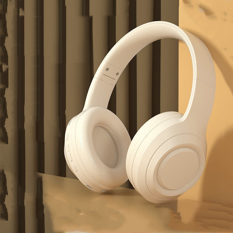 Noise Reduction Bluetooth Wireless Music Headset -
Beige headphones on a textured surface with a warm color tone