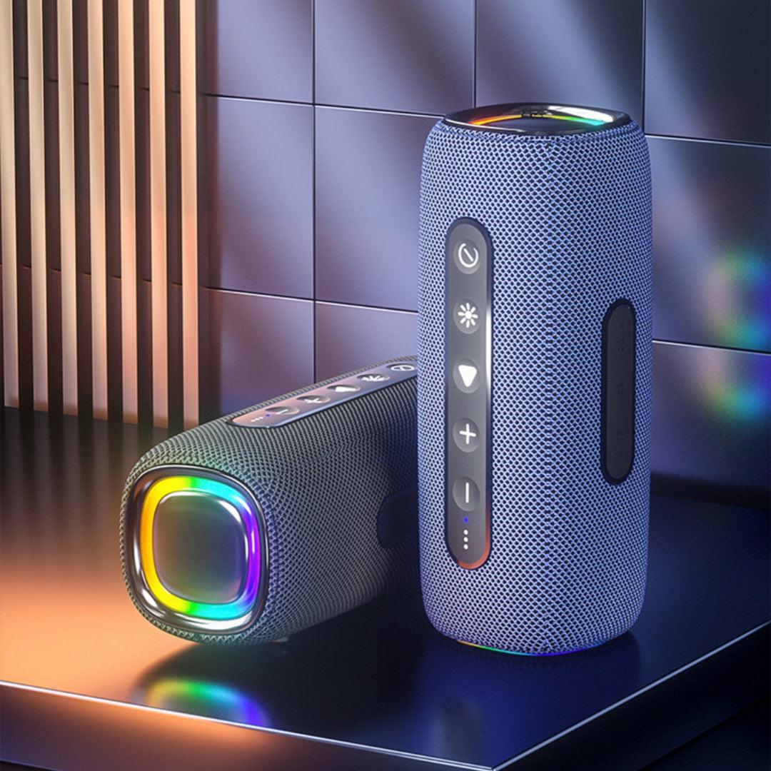 Two Bluetooth speakers with colorful LED lights on a reflective surface.