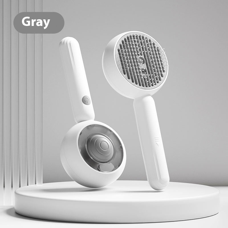 White handheld shower head with bristle brush on a gray background