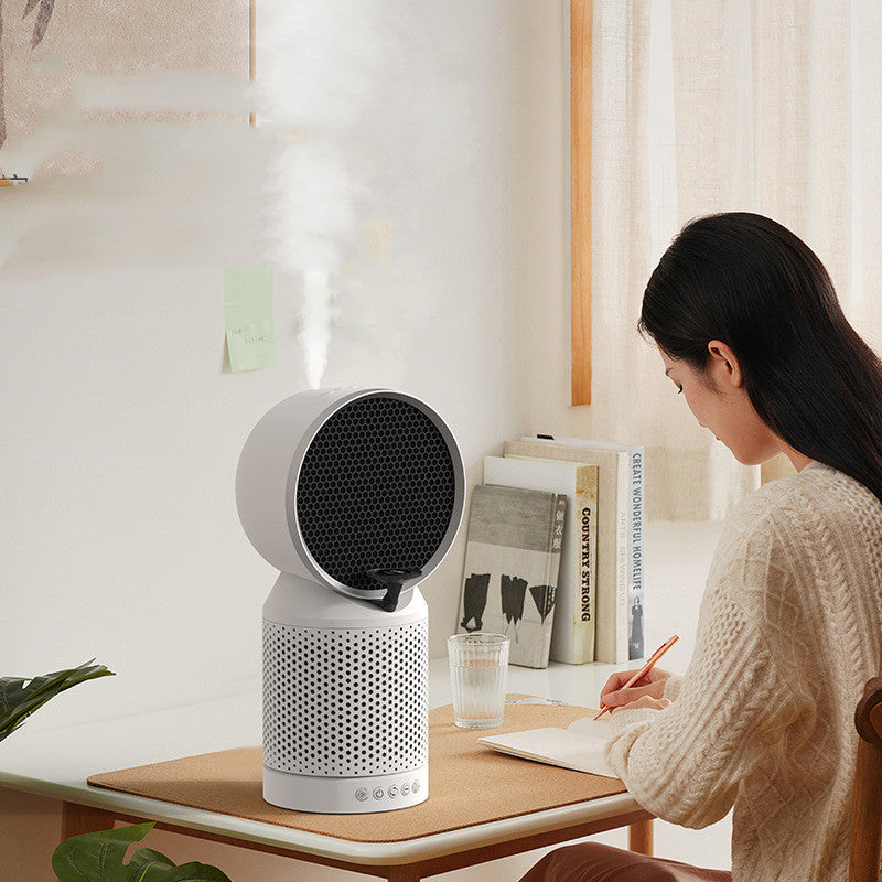 White Noise Ionizer Humidifier Purifier -
Person sitting at a desk with a white and black air purifier on the table.
