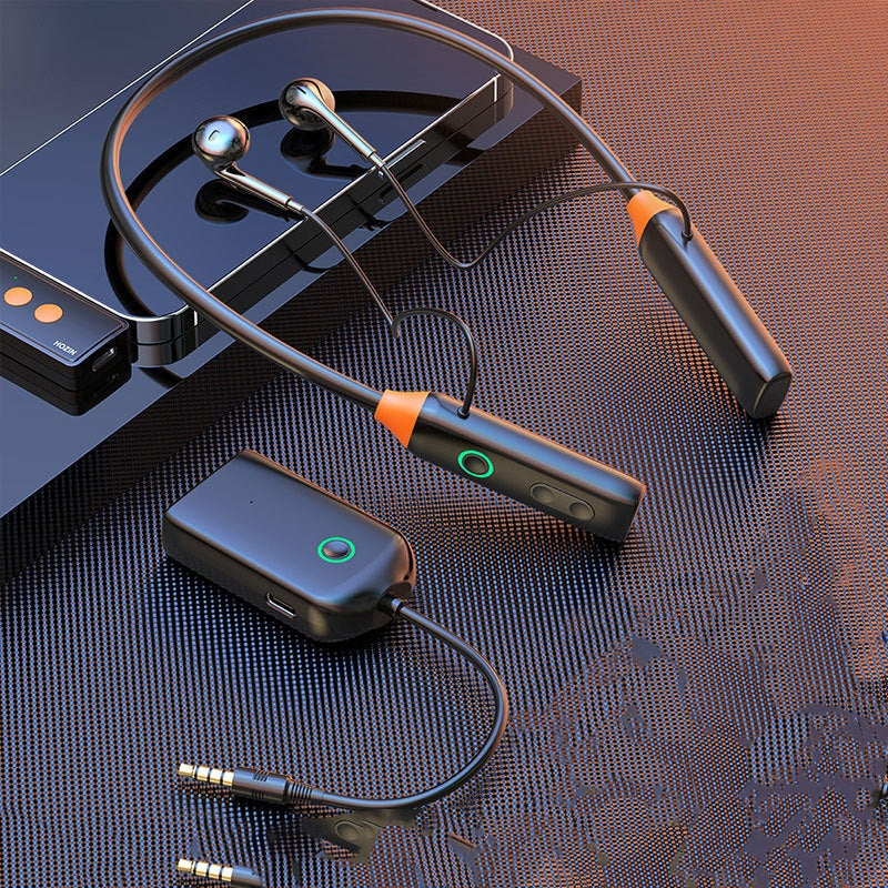 Wireless Neck-Mounted Monitor Studio Earphones - Wireless earbuds with charging case and accessories on a textured surface