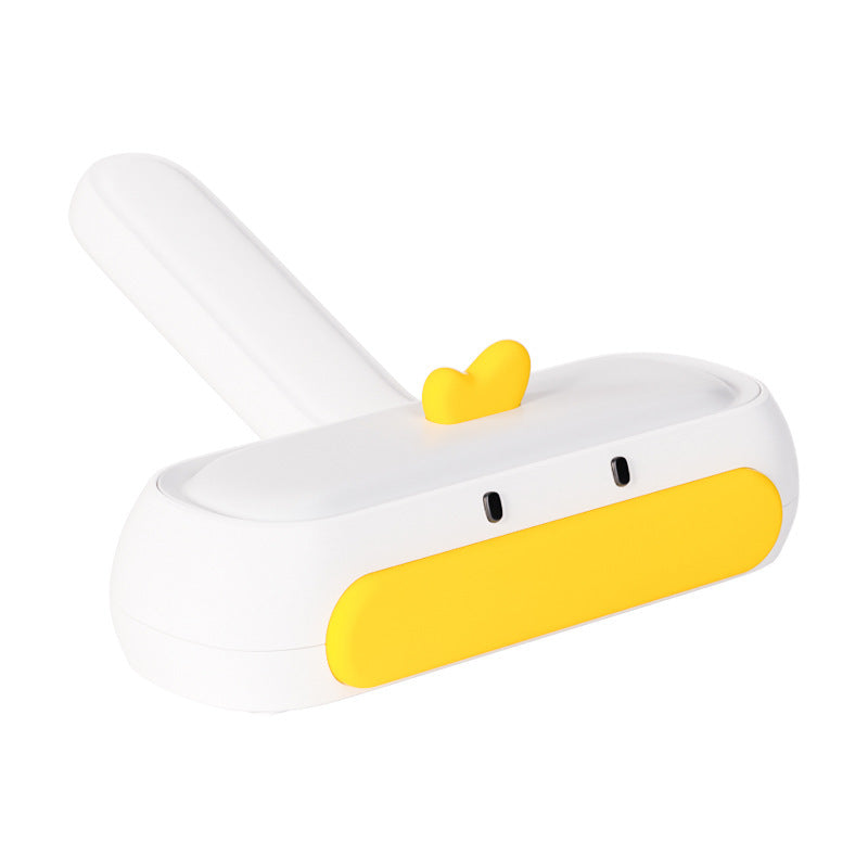 White and yellow electronic device with a heart-shaped button on a white background