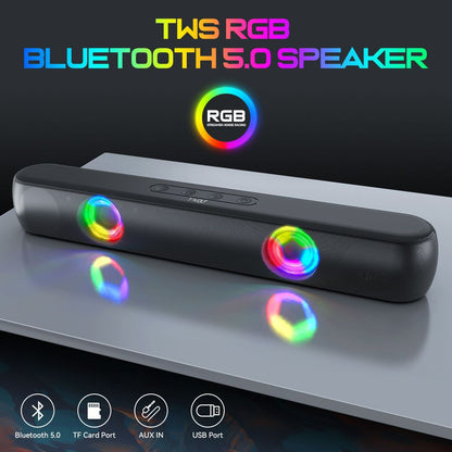 TWS RGB Bluetooth 5.0 speaker with colorful LED lights on a reflective surface.
