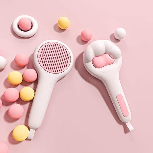 Two pink and white grooming tools on a pink background with colorful round objects.