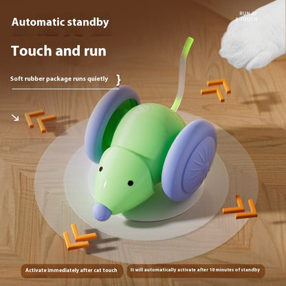 Toy mouse with green body and purple wheels on a wooden surface, featuring text about automatic standby and touch and run functions.
