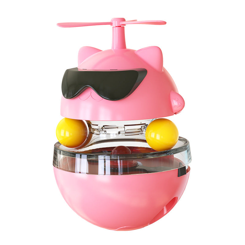 Pink toy with yellow balls and a propeller on a white background