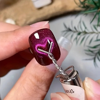 Corkscrew with a glittery purple handle held by a hand