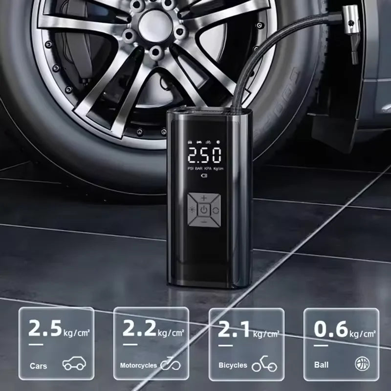 Portable air compressor with digital display next to a car tire on a tiled floor.