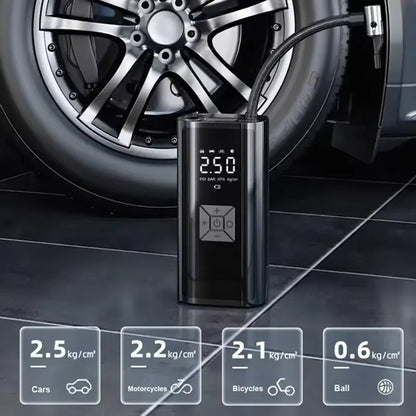 Portable air compressor with digital display next to a car tire on a tiled floor.