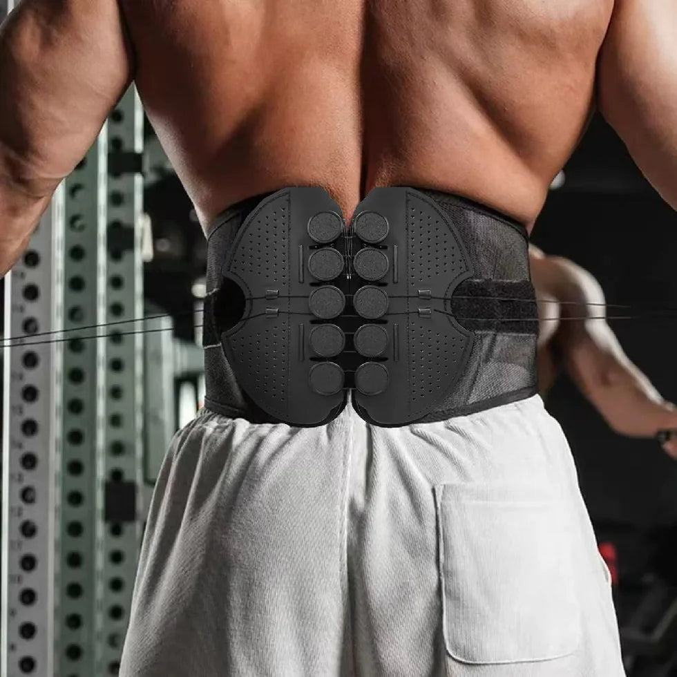 Person wearing a black back support brace in a gym setting