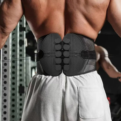 Person wearing a black back support brace in a gym setting