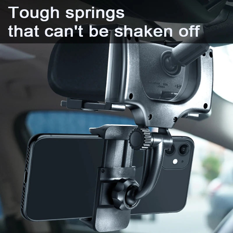 Car phone mount with text 'Tough springs that can't be shaken off' inside a vehicle.