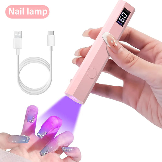 Pink nail lamp with digital display held by a hand, showing nails being illuminated.