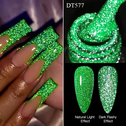 Green glitter nail polish with natural light and dark flashy effect shown on nails and swatch.