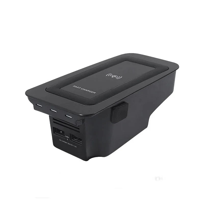 Black car console organizer with USB ports on a white background