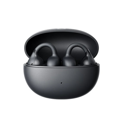 Black wireless earbuds in a round charging case on a white background