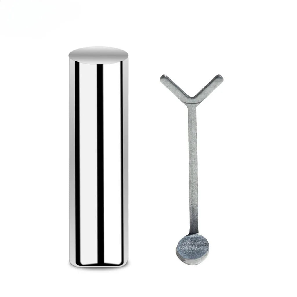 Silver cylindrical container and spoon on a white background