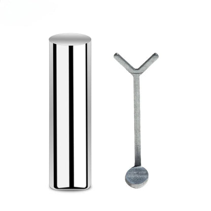 Silver cylindrical container and spoon on a white background
