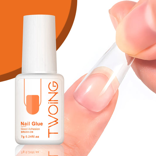 Bottle of TWOING nail glue with a dropper being used on a white background