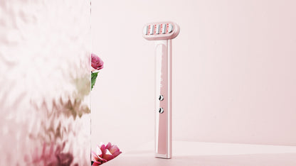 Pink electric toothbrush on a light pink background with floral elements