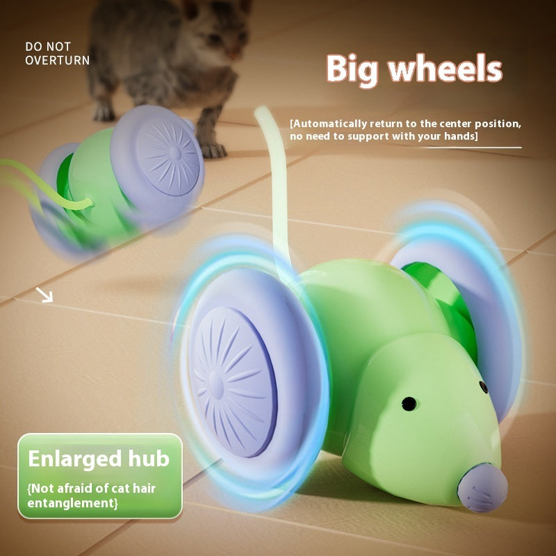 Cat toy with big wheels and enlarged hub on a tiled floor, with a cat in the background.