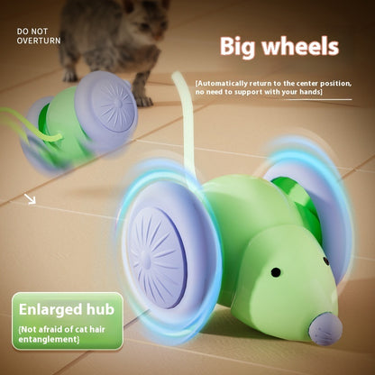 Cat toy with big wheels and enlarged hub on a tiled floor, with a cat in the background.