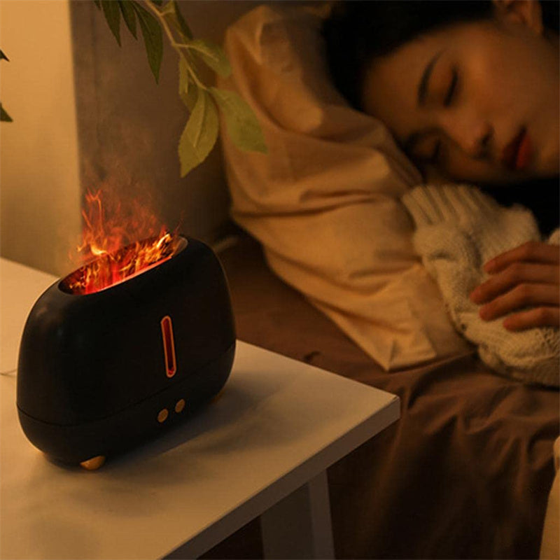 Person sleeping with a fire pit-like device on a table next to them