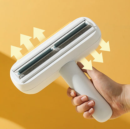 Hand holding a white pet hair remover against a yellow background