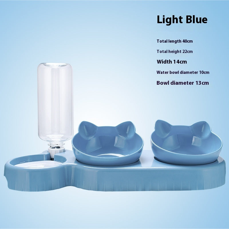 Light blue pet feeding station with water bottle and bowls on a light blue background