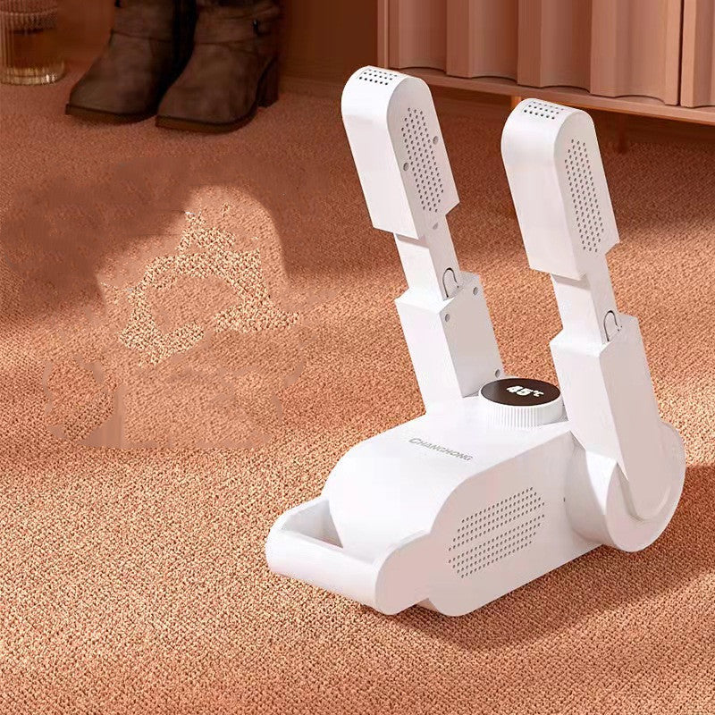 White shoe dryer on a carpeted floor with shoes in the background