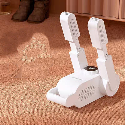 White shoe dryer on a carpeted floor with shoes in the background