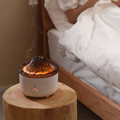 Volcano Flame Humidifier Aroma Diffuser -
Decorative lamp with lava design on a wooden table next to a bed.