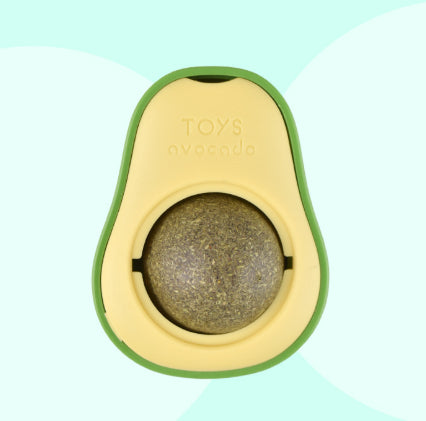 Avocado-shaped toy with a ball inside on a light green background