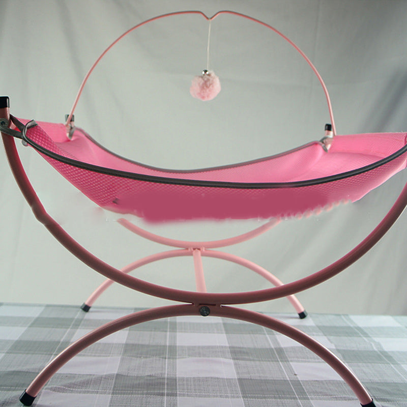 Pink baby hammock with stand on a checkered floor against a plain background