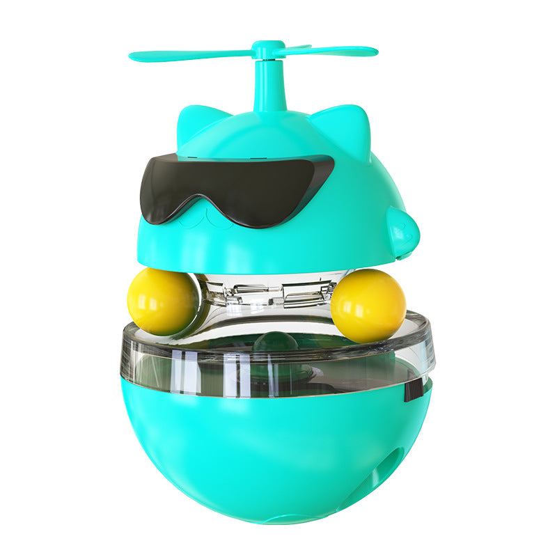 Turquoise toy with yellow balls and a propeller on a white background
