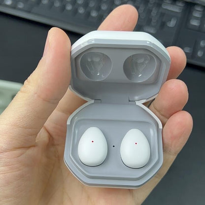 Ultra-Long Battery Bluetooth Sleep Headset - White wireless earbuds in an open case held by a hand with a keyboard in the background.